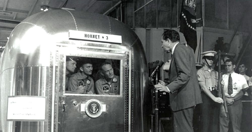 President Nixon talks to the crew of Apollo 11 from outside of their Airstream / Via NASA