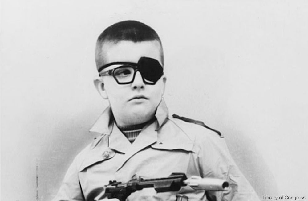 Boy with an Eye Patch and Toy Gun