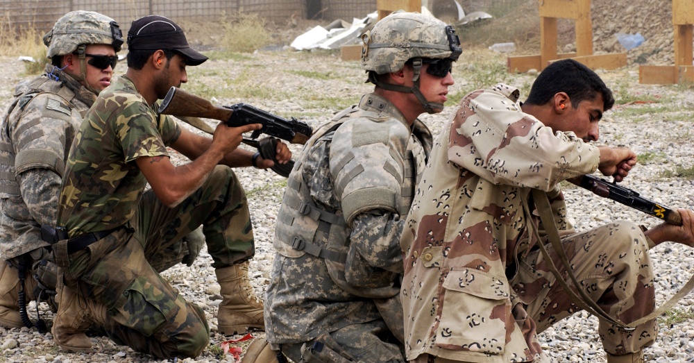 U.S. Army soldiers and Iraqi police officers during an AK-47 training exercise / Via U.S. Army and Airman 1st Class Christopher Hubenthal, U.S. Air Force