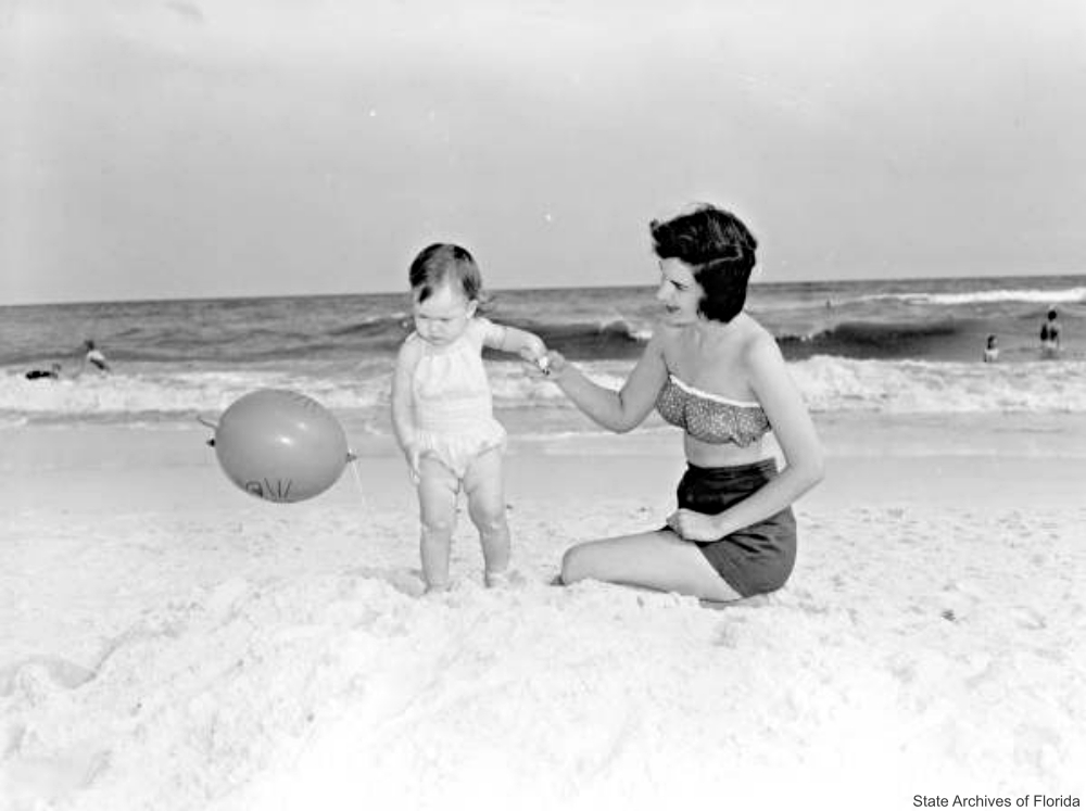 Mother and Baby on the Beach with Balloon