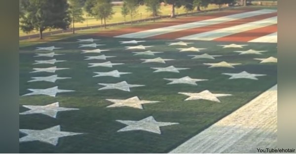 For years, a 300-by-600-foot flag was painted on Bob Burr's front yard.