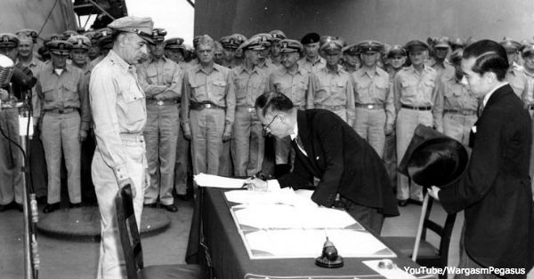 Japanese foreign affairs minister Mamoru Shigemitsu signs the Japanese Instrument of Surrender on board USS Missouri.