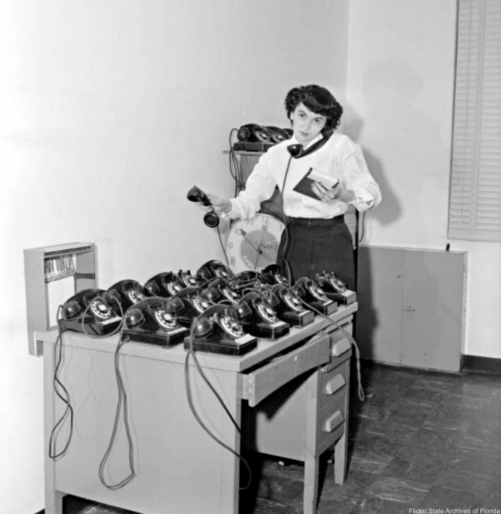 Mrs. Red Taylor with desk full of phones