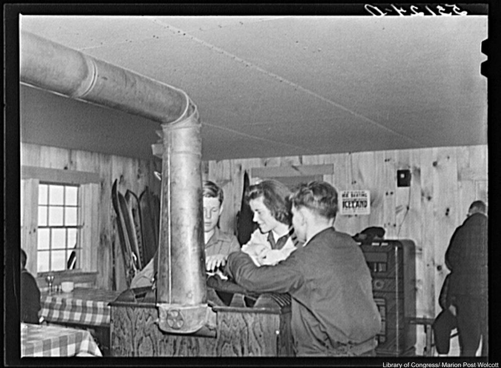 Kids Warming Themselves By A Stove