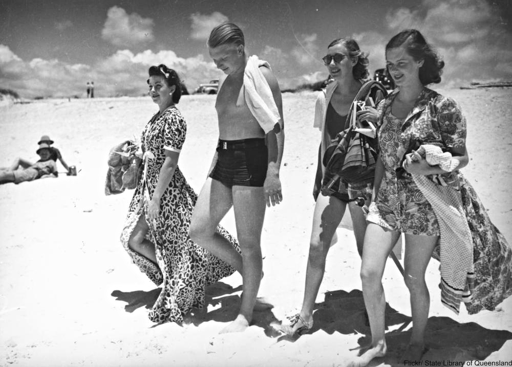 1940s group on beach, man in swim trunks