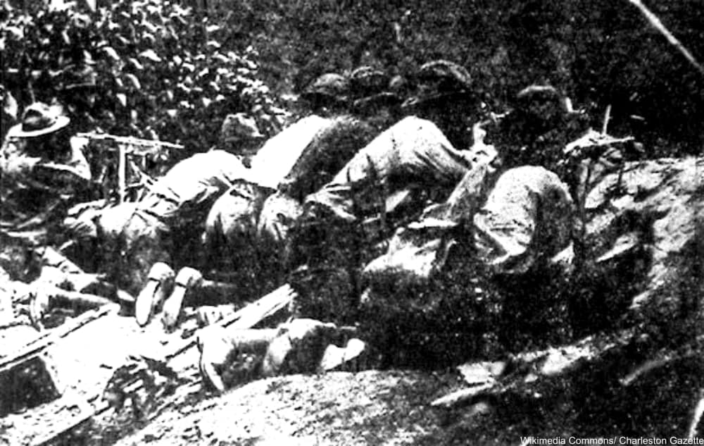 Sheriffs men firing at miners during the Battle of Blair Mountain