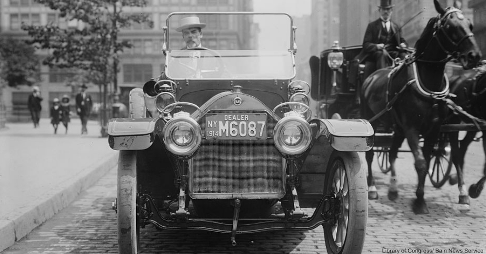 Automobile and Horse-drawn carriage in same street