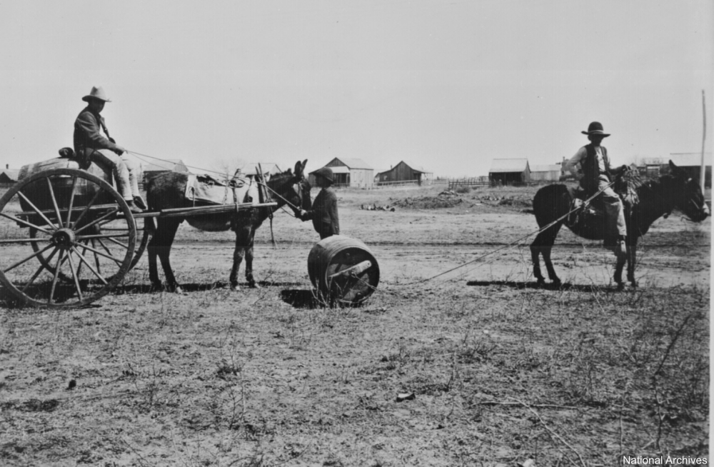 hauling water via wagon and barrel circa 1905