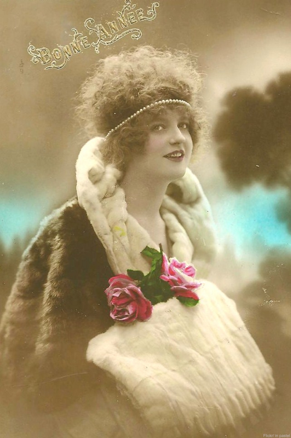 Hand-tinted photograph postcard.