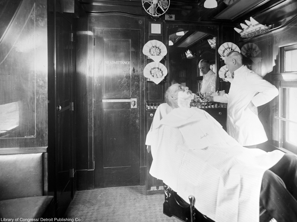 Deluxe overland limited train barber shop car, 1910s.
