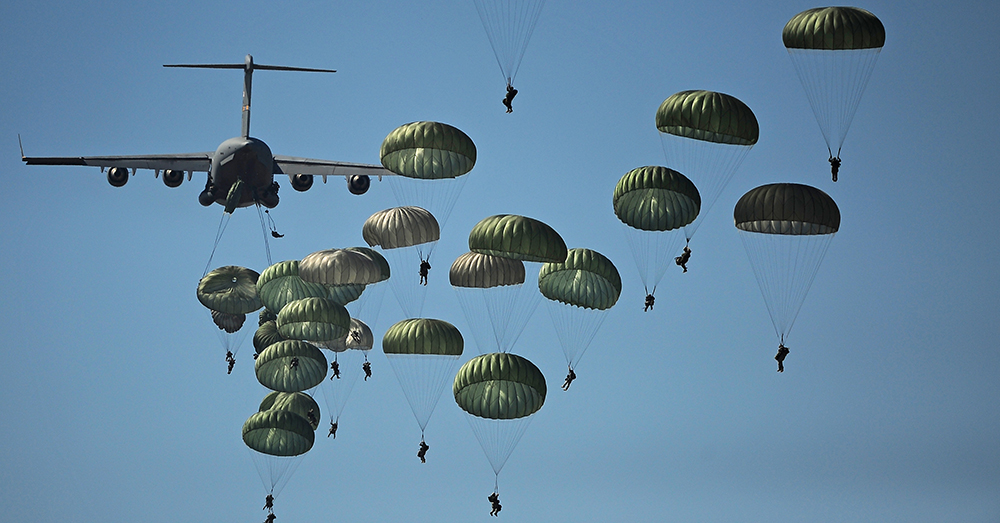 Photo: U.S. Air Force/A1C James Richardson -- 82nd Airborne Division Paratroopers blanket the sky as they descend from a C-17 Globemaster.