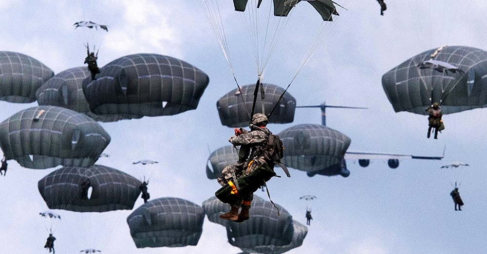 Photo: Facebook/82nd Airborne Division -- Paratroopers from the 82nd Airborne descend from the sky.