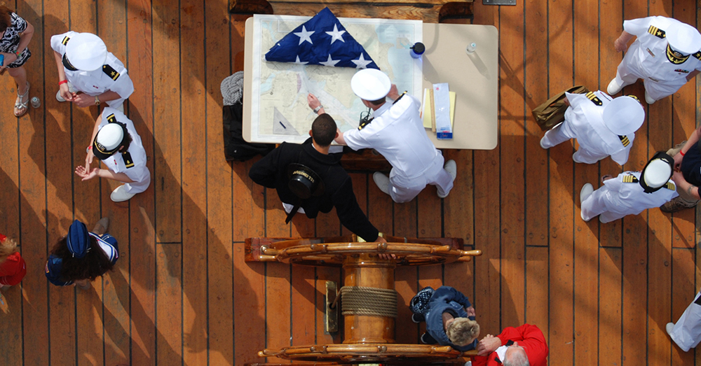 Photo: U.S. Navy/Mass Communication Specialist 3rd Class Kathryn E. Macdonald -- Seaman Jared Hutchins, left, and Lt. j.g. Gerin Choiniere plot a course for USS Constitution in Boston Harbor.