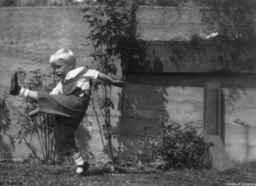 boy playing kick the can