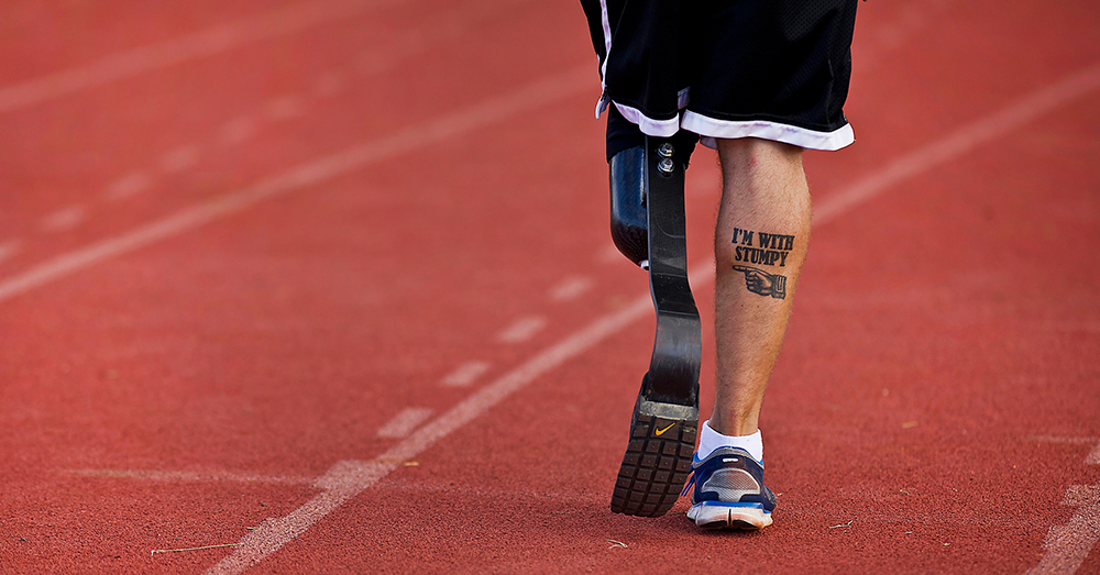 Photo: U.S. Air Force/Tech. Sgt. Michael R. Holzworth -- U.S. Navy Petty Officer 3rd Class Redmond Ramos, a corpsman, displays a tattoo that reads "I'm with Stumpy" showing his sense of humor. He lost his leg in 2011 while serving in Afghanistan.