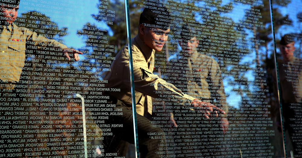 Photo: U.S. Marine Corps/Lance Cpl. Neysa Huertas Quinone -- Marines with Alpha Battery, 2nd Low Altitude Air Defense Battalion point out names at the Onslow County Vietnam Veterans Memorial, Jacksonville, N.C.