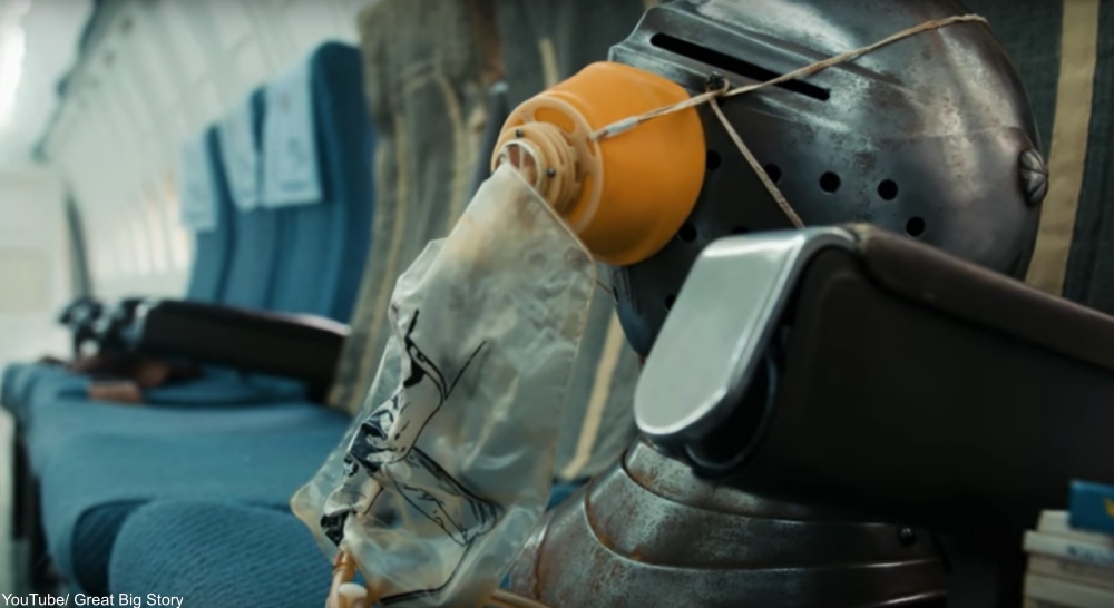 a knight's helmet with a gas mask serves as a humorous display