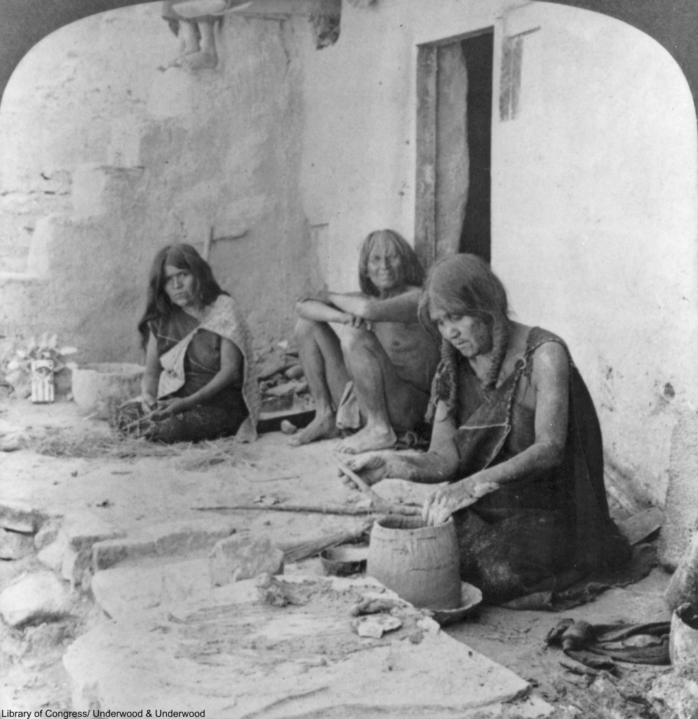 Hopi woman using the coil method to build a pot, circa 1903