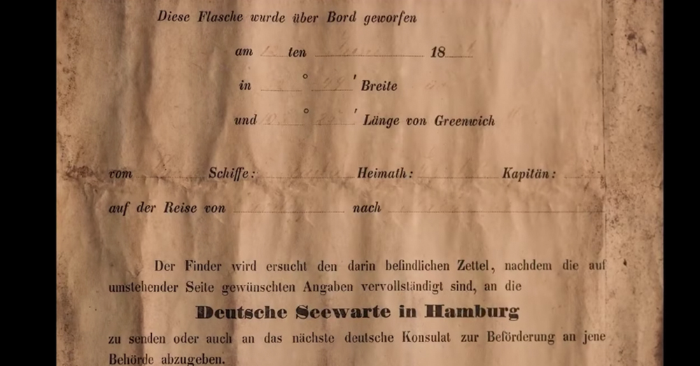 Screenshot: YouTube/Kym Illman -- Faint handwriting by the ship's captain can still be read on the note, which was used to study ocean currents.