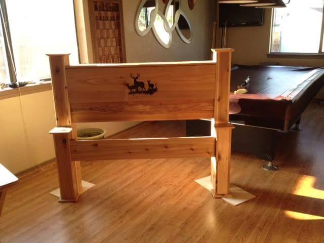 From John Morrow: A head and foot board my wife cindy a and I made out of cedar. She free hand the deer into the headboard.