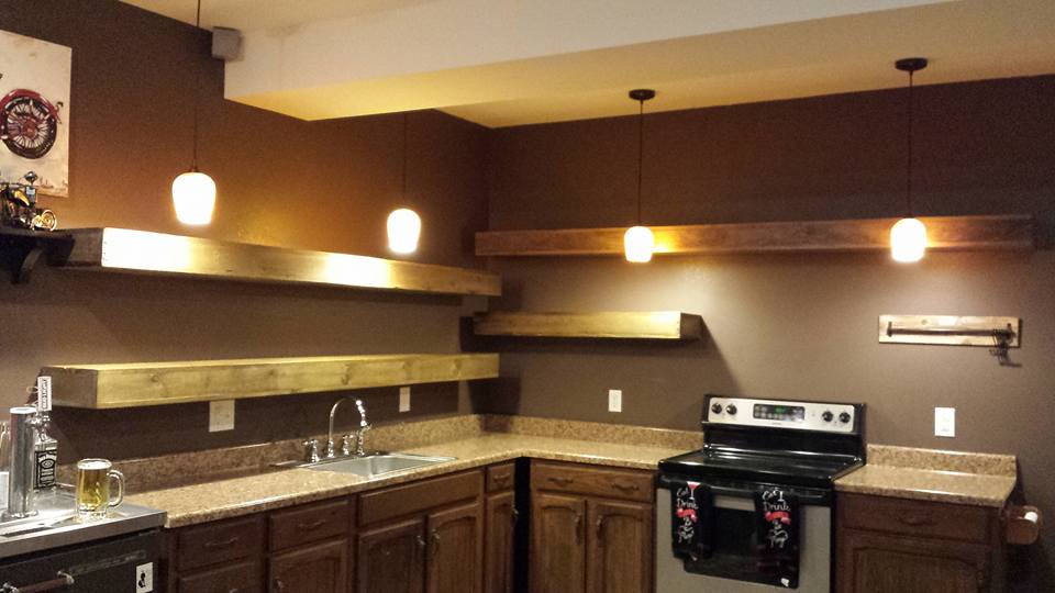 From John Lawson: The last custom project for the year is installed, 8 foot & 9 foot long floating shelves. Home made stain/oxidizing agent and a few coats of semi-gloss.