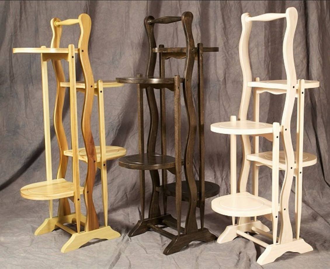From Ken Forsberg: My interpretations of an antiquated violet stand. Christmas presents inspired from an original creation of bygone furniture builders: California Furniture Shops LTD. Articulating shelves fold up. Conversion varnish on poplar; green poplar selected for color.
