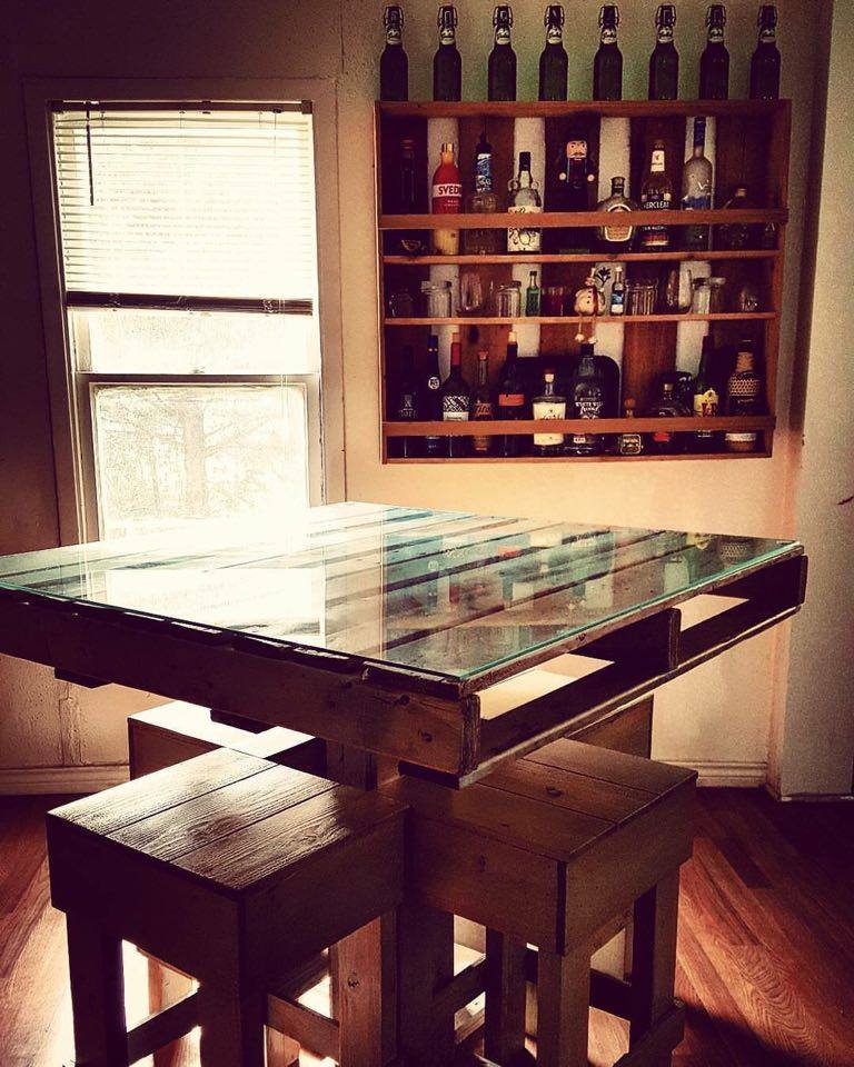 From Krista Huber: Pallet table and liquor shelves/wall bar made by Adam Medina-Trojacek for our first home