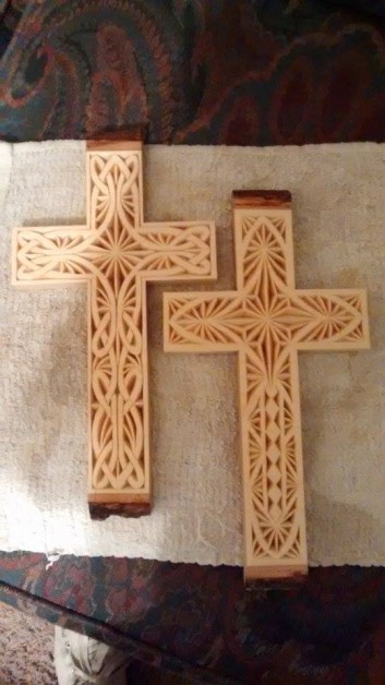 From Brenda Meairs: Two chip carved crosses from basswood with bark still on the top and bottom. I carved these month ago.