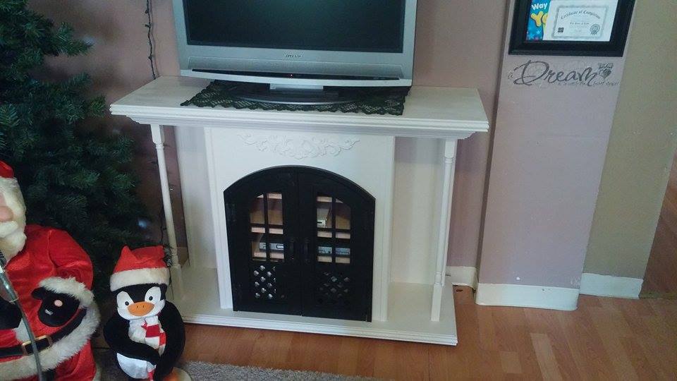 From Thomas Welch: I call it my Firetainment Place it looks like a firebox/mantle piece but its actually an entertainment center. 3/4 Birch Ply, Pine mouldings and poplar spindles.