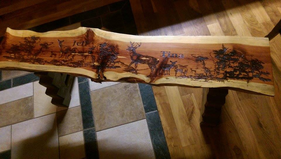 From Austin Myers: This is a bench that I made out of aromatic cedar. It has custom laser engraving and was made specifically for a sportsman show raffle prize.