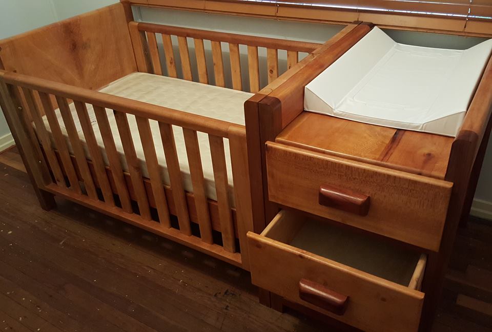 From Cameron Summerville: a picture of the baby cot I made. It is mostly silky oak with she oak legs and red cedar draw handles. Shellac finish.