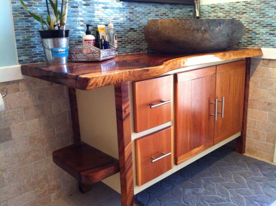 From Chad Fleming: Monkey pod top & legs, dried ten years on Kauai. cedar body and doors/ drawers. Sink is stone from Bali.