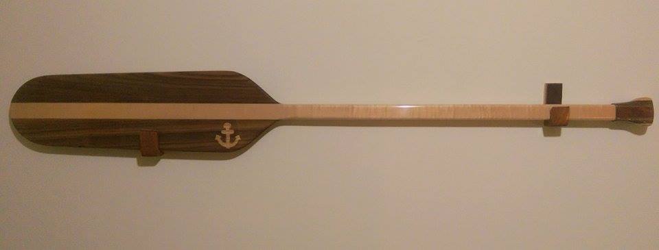 From Justin Fulton: An ottertail canoe paddle I just finished, with mahogany wall hangers, padded with leather.