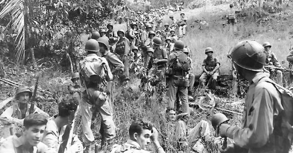 Source: Wikimedia Commons Marines rest in a field on Guadalcanal.