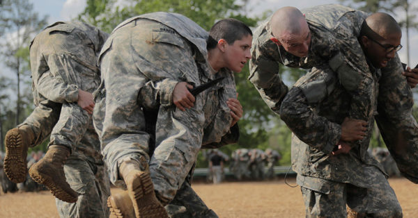 Source: U.S. Department of Defense Women recruits make their way through training in a swamp environment.