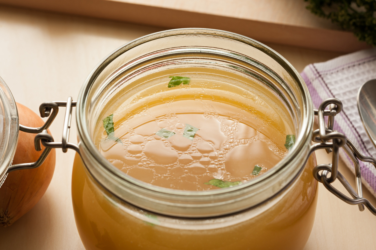 Bone broth made from chicken in a glass jar