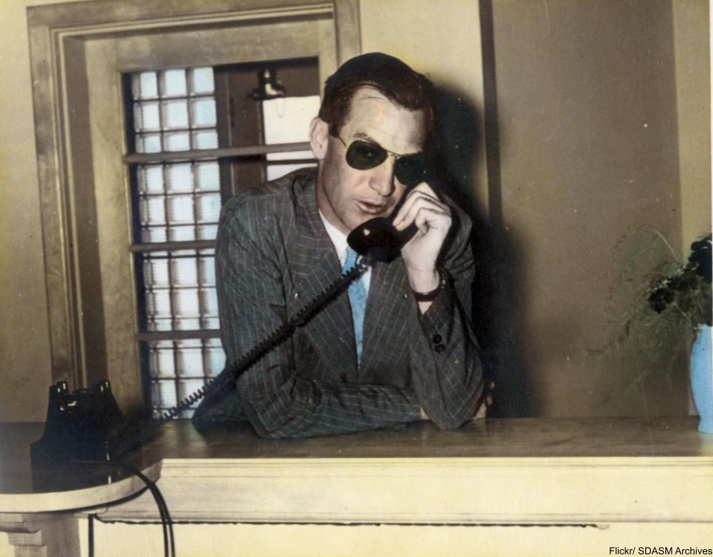 man talking on old-fashioned telelphone