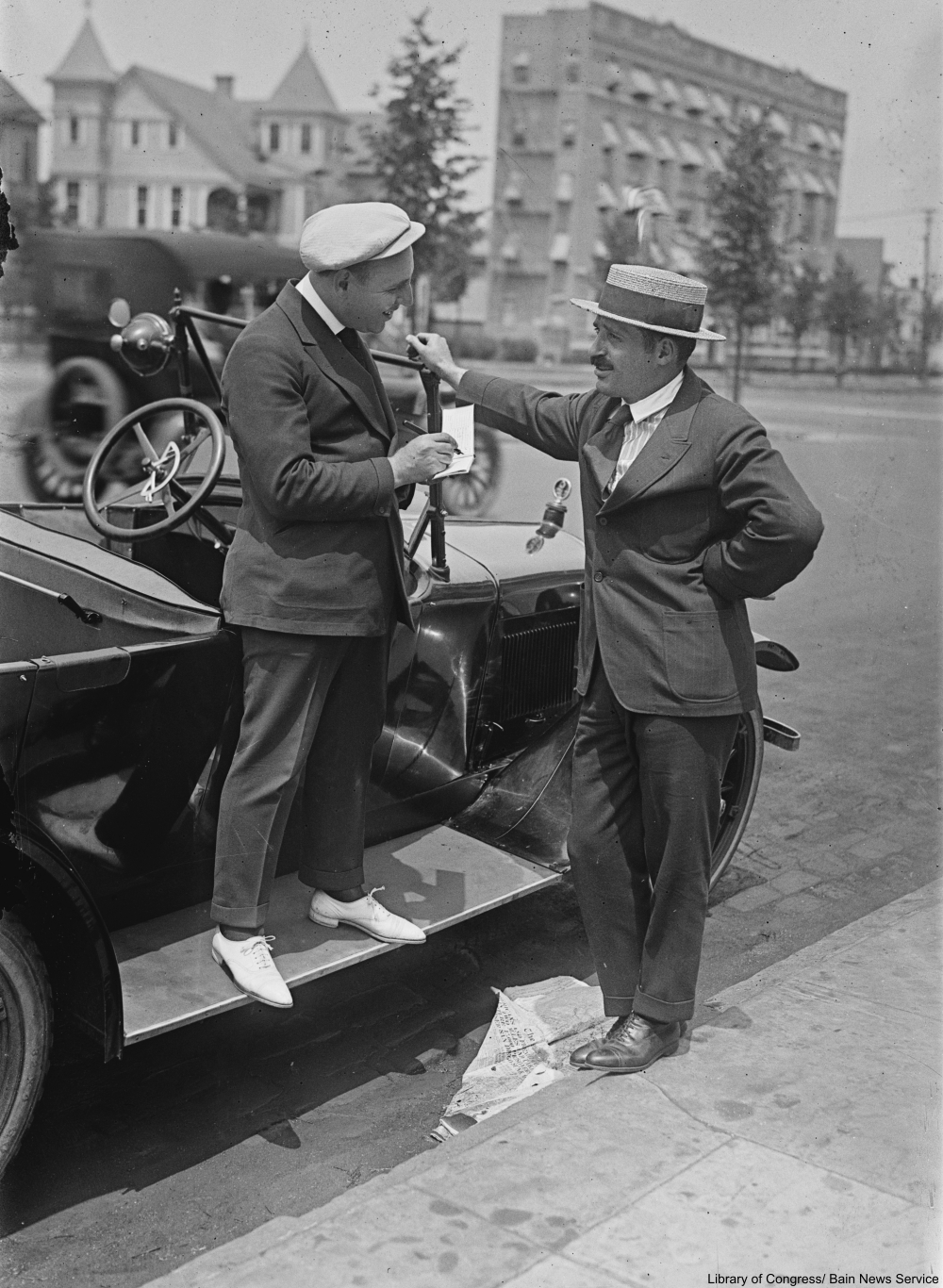 men in hats talking on the street