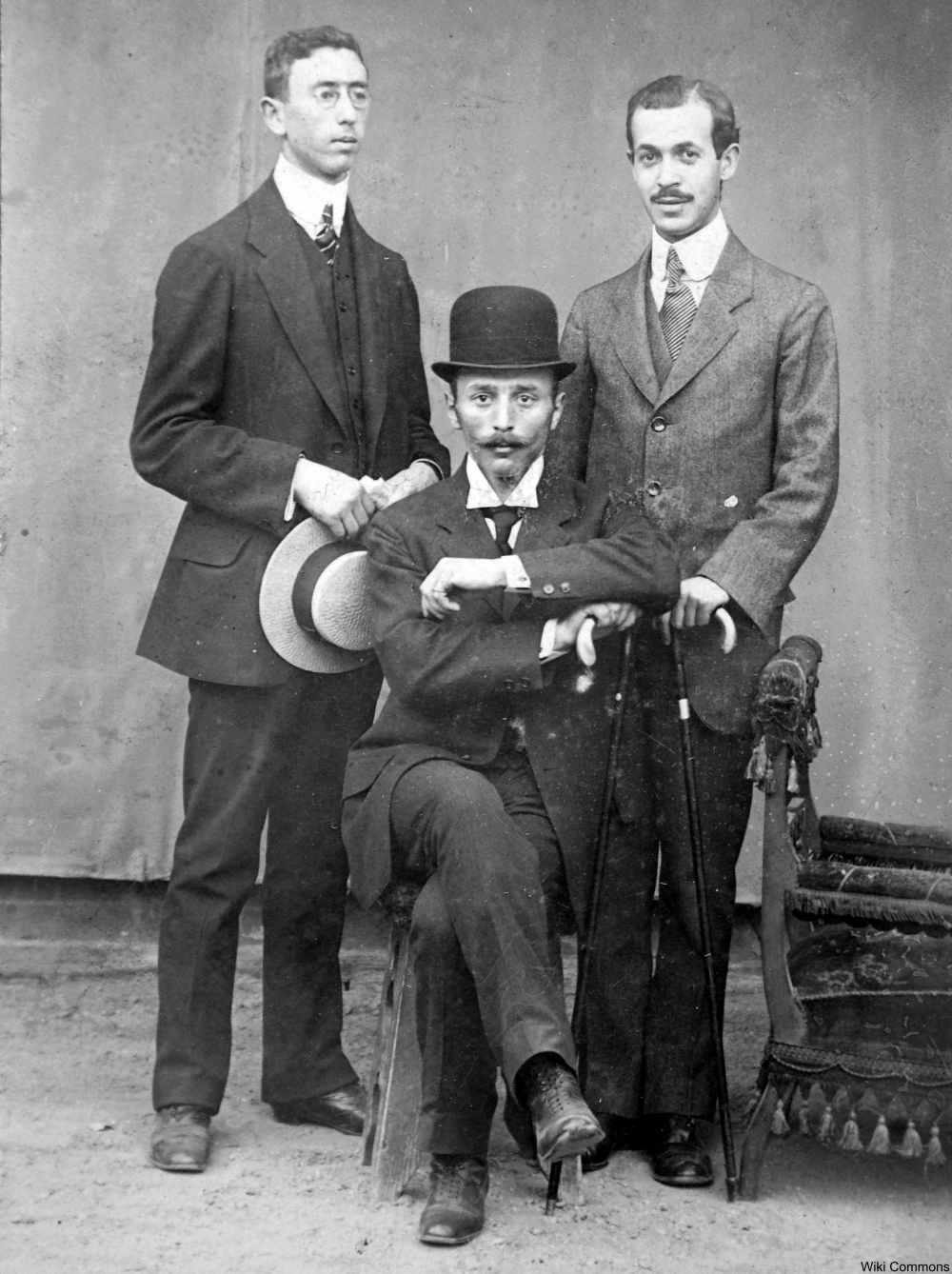 men in hats posing for a portrait
