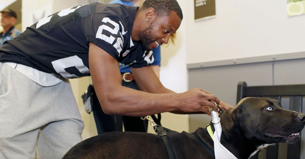 Source: YouTube/Wochit Entertainment An Oakland Raiders player meets one of the contestants in the big game.