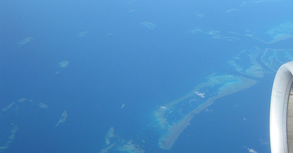 Source: Wikimedia Commons The Great Barrier Reef from an aircraft, thousands of miles above the Pacific Ocean.