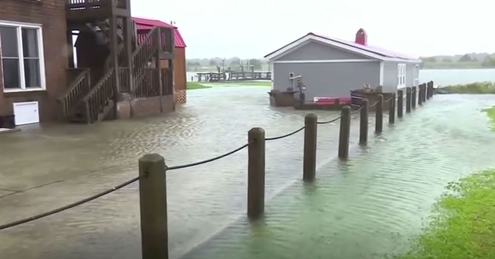 Source: YouTube/Wochit News Flooding from Tropical Storm Florence has forced some to take to their roofs as help arrives.