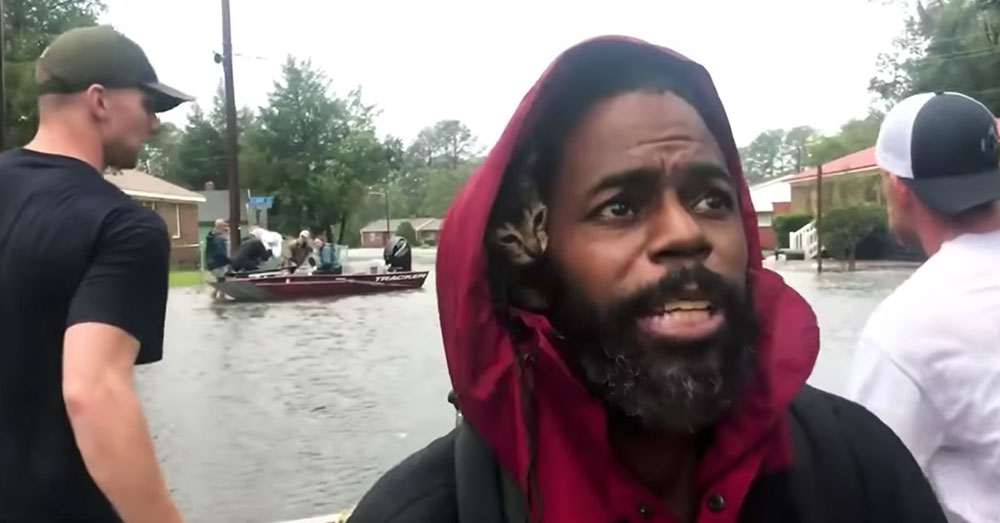 Source: YouTube/Charlotte Observer Robert Simmons, Jr., carries his cat,
