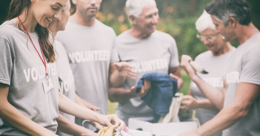 A group of volunteers creating care packages