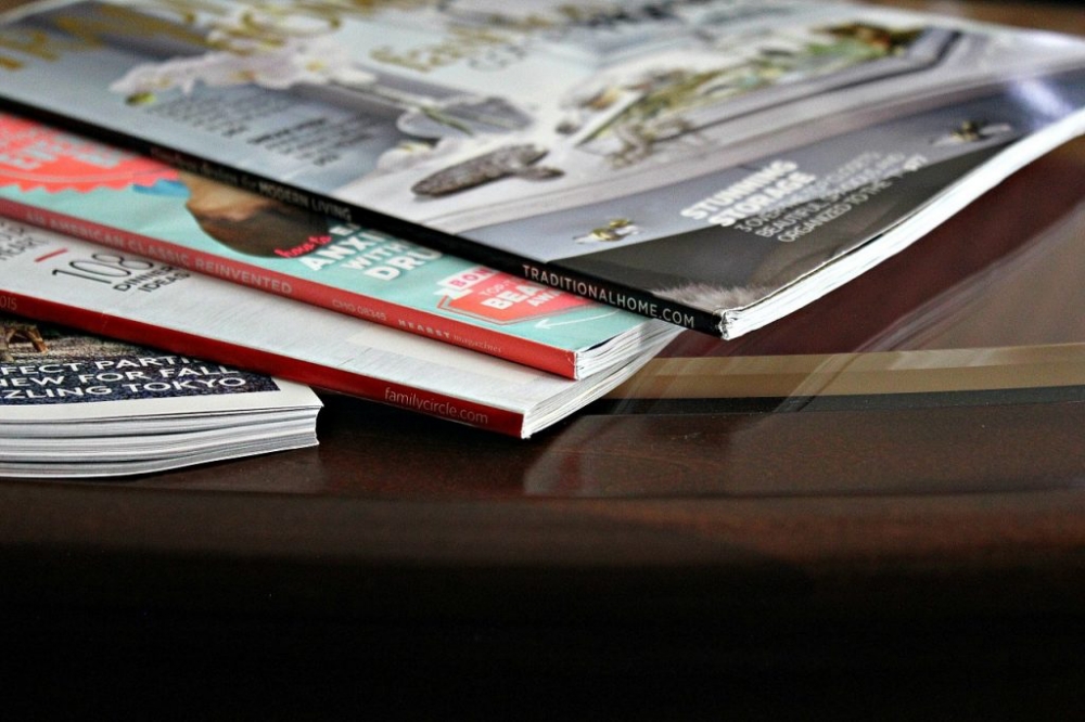 magazines scattered on table
