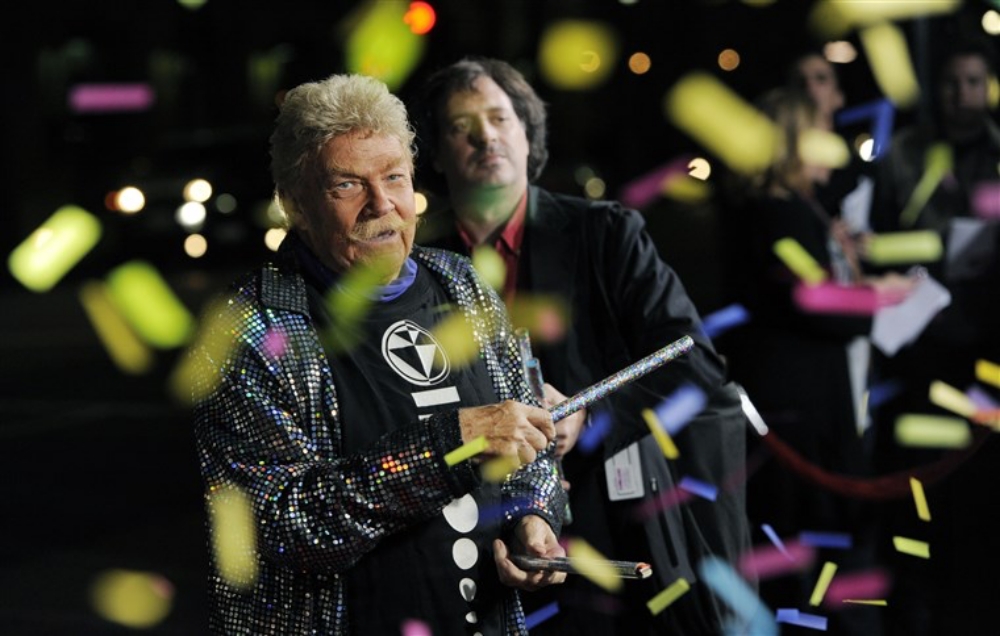Rip Taylor surrounded by confetti