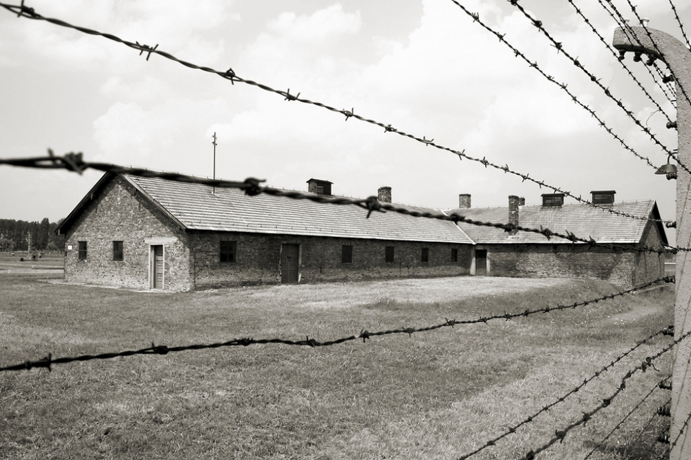black and white photo of Auschwitz death camp