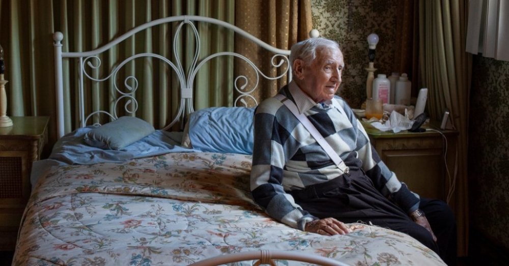 David Wisnia sitting on a bed