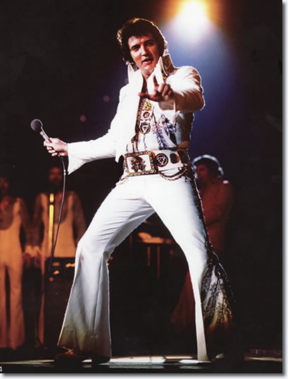 Elvis Presley on stage in his famous white jumpsuit