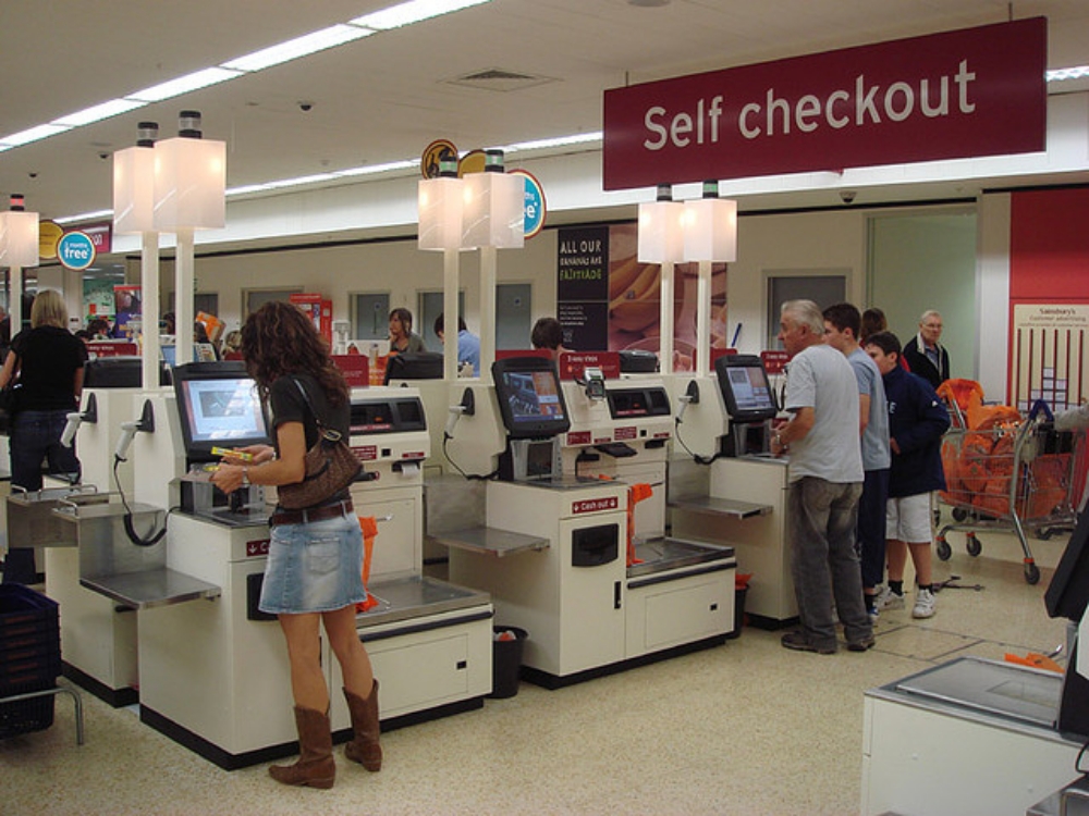 self-checkout machines in a grocery store